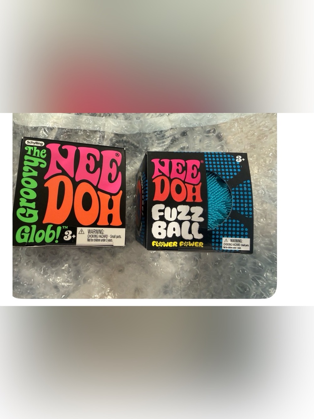 Nee Doh Fuzz Ball (blue) & Groovy Glob (orange)